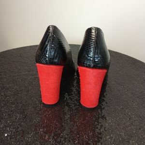 Black pumps with red heels